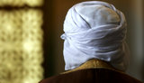 Muslim man praying in a London mosque (photo: AP)